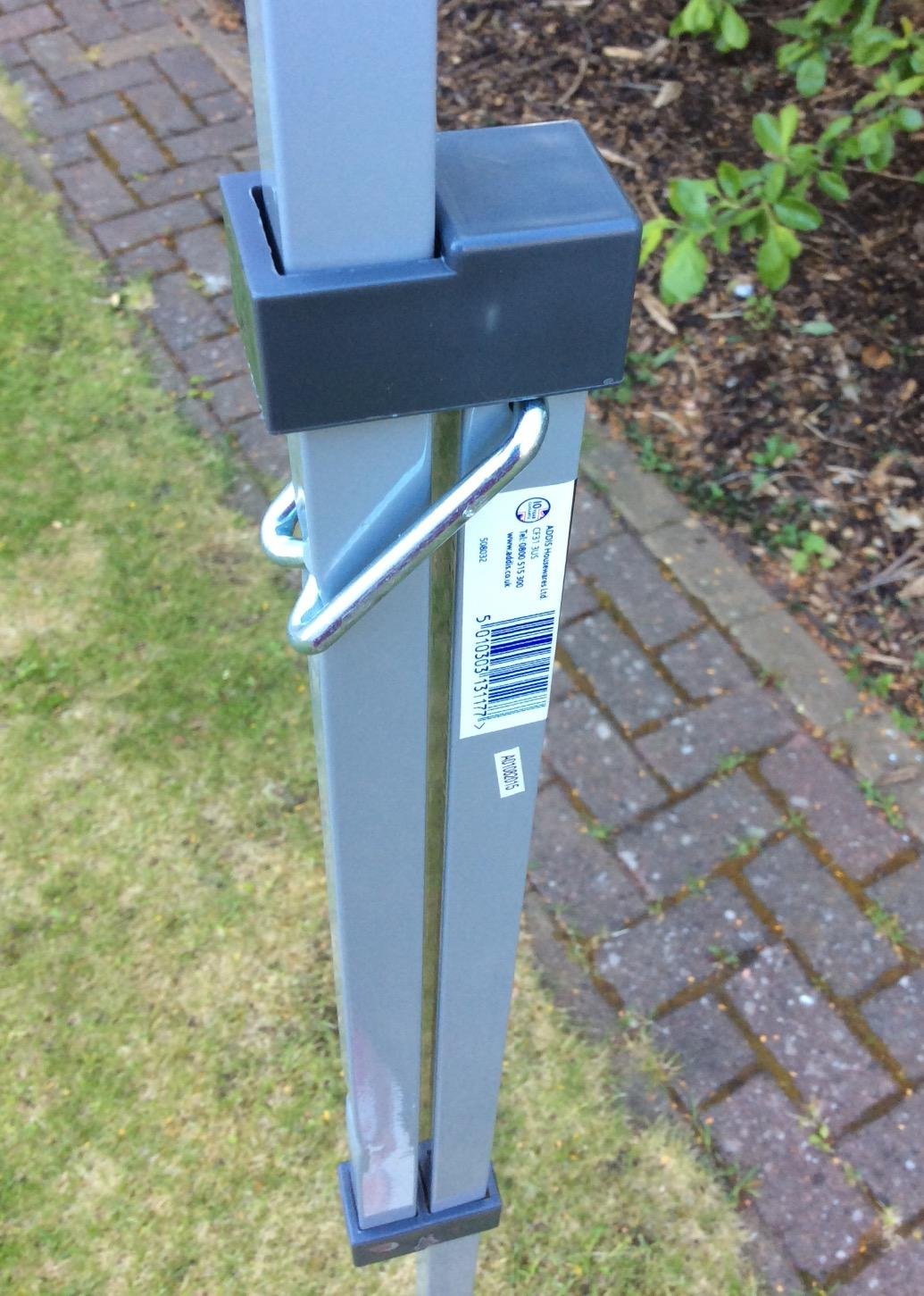 Metal washing line prop in a garden – How to Stop Your Washing Line From Sagging