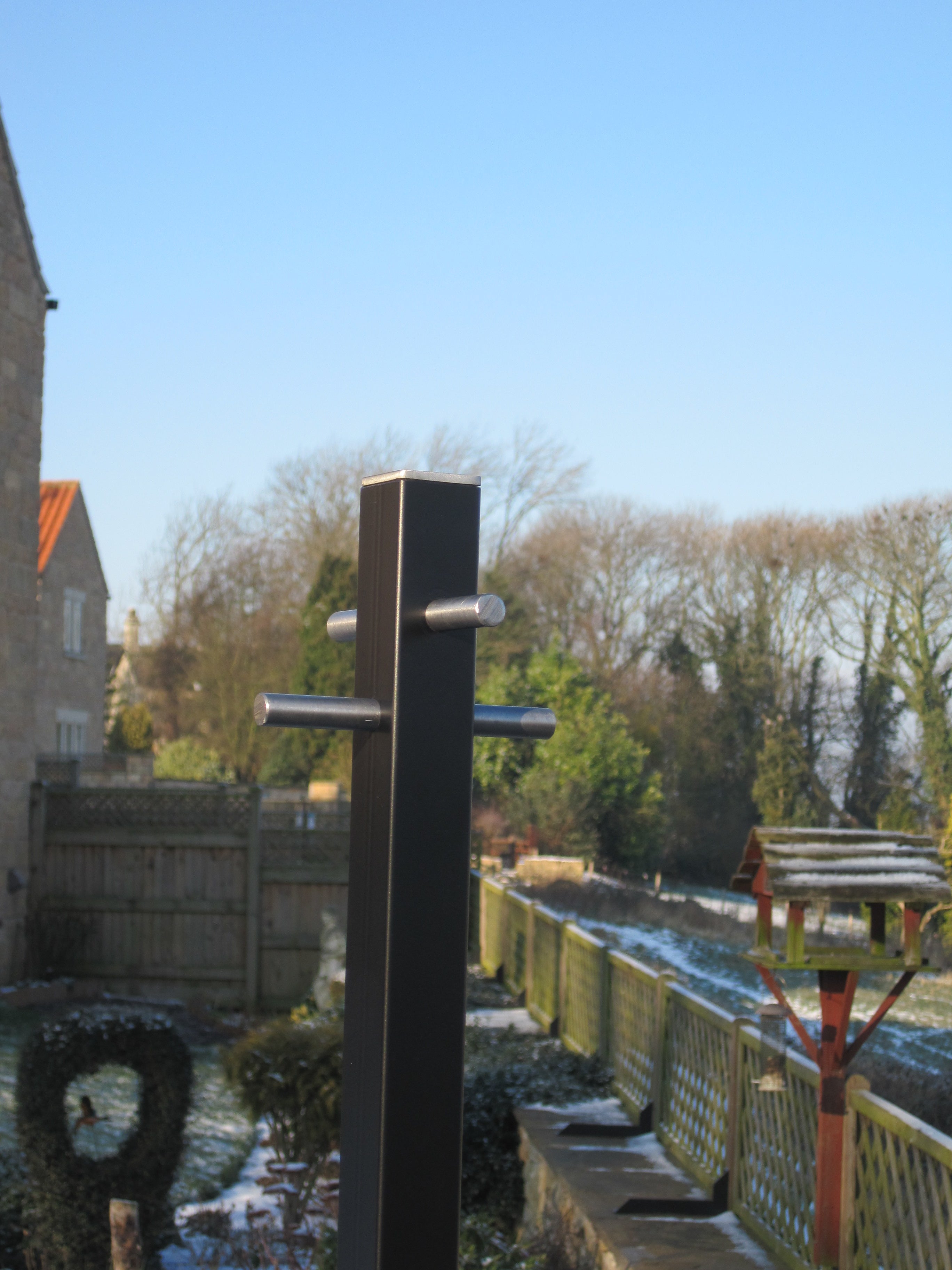 Square black steel washing line post made in Sheffield – Celebrating Helga Stentzel's Clothesline Creatures