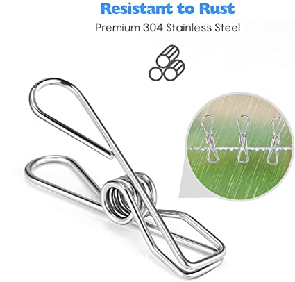 Stainless steel pegs clipped onto a washing line holding laundry in place