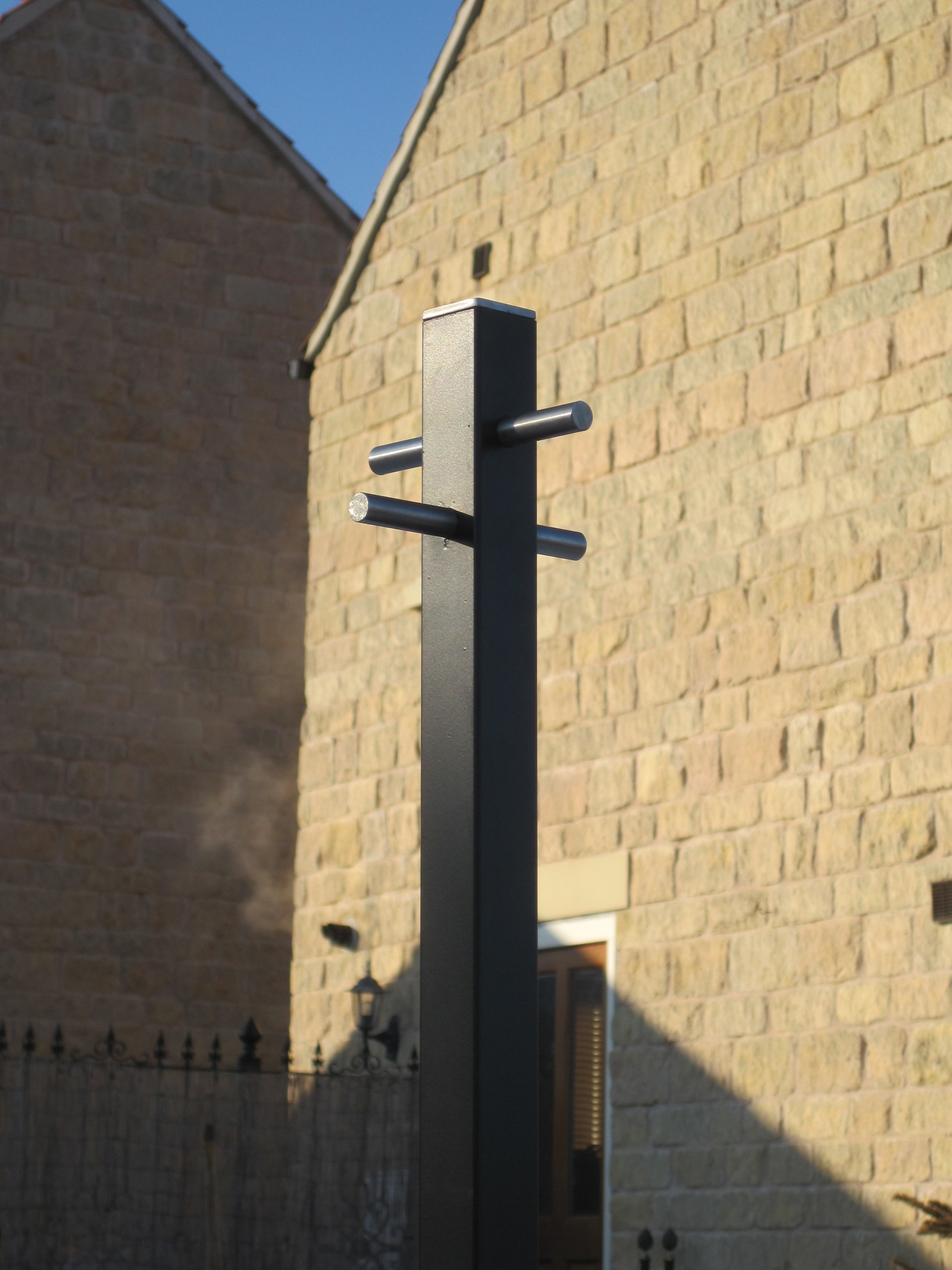 Contemporary square black steel clothes line post with stainless steel fittings