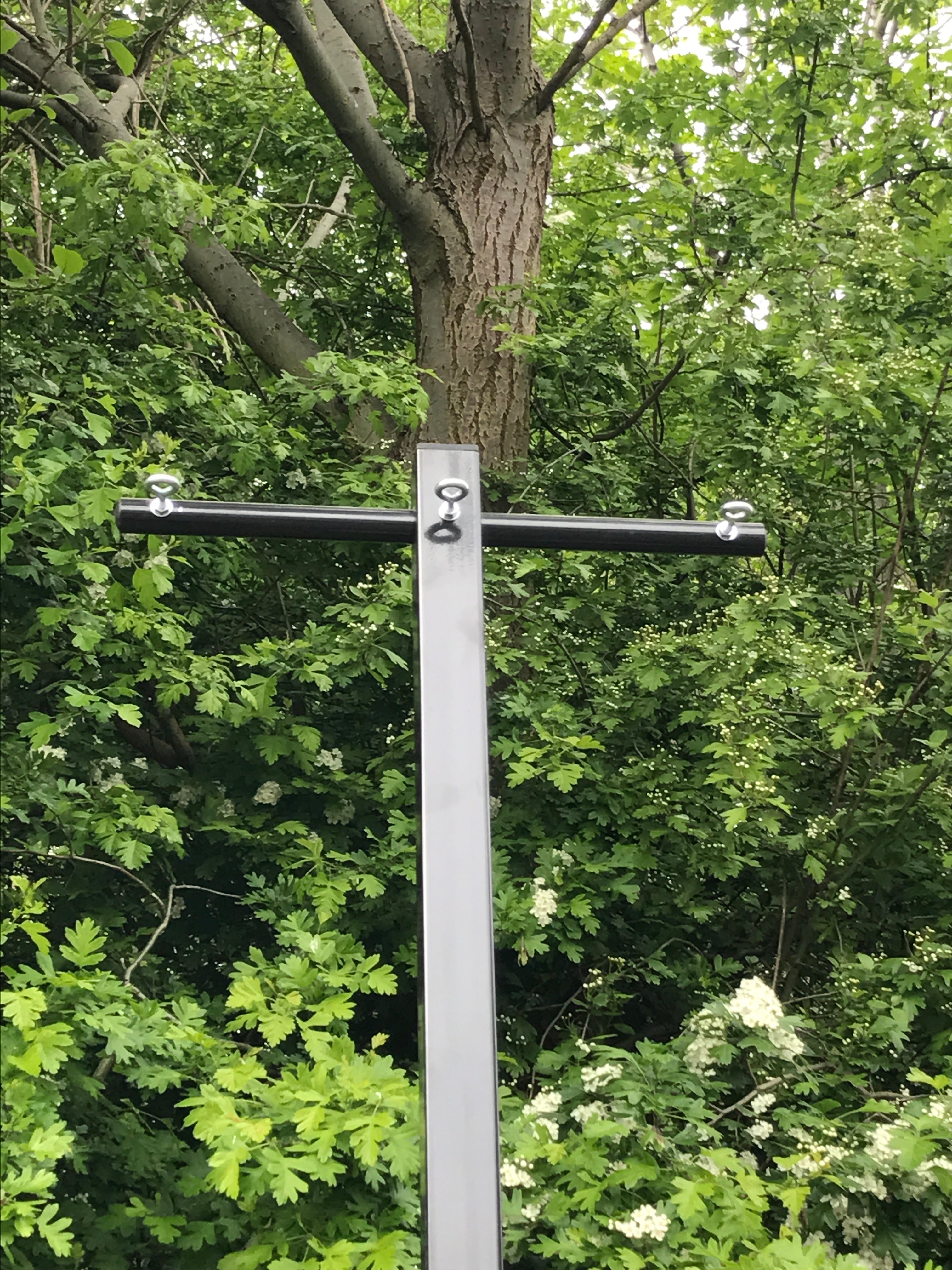 Close-up of the line-fixing arms on the multi-line clothes post