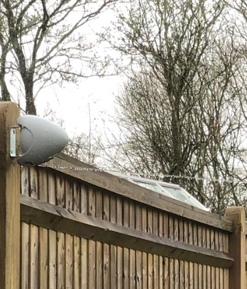 Wall mounted retractable washing line reel with the clothes line pulled out