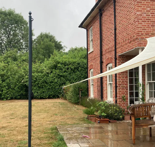Galvanised steel shade sail pole with a fixing eye for anchoring a garden shade sail