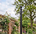 Traditional heavy-duty galvanised metal washing line pole in a UK garden