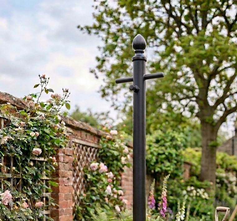 Traditional heavy-duty galvanised metal washing line pole in a UK garden
